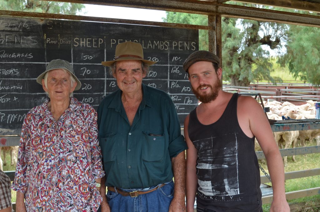 Warwick locals Sandra, Brian and Luke Campbell taking a look at yesterday's sheep sale. Photo Sophie Lester / Warwick Daily News